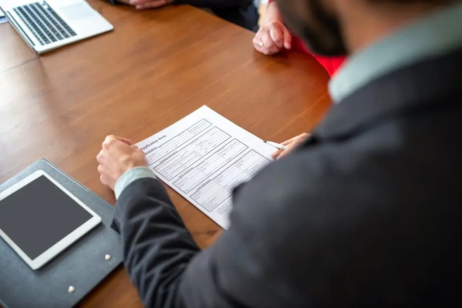 Rental applicant filling out an application form