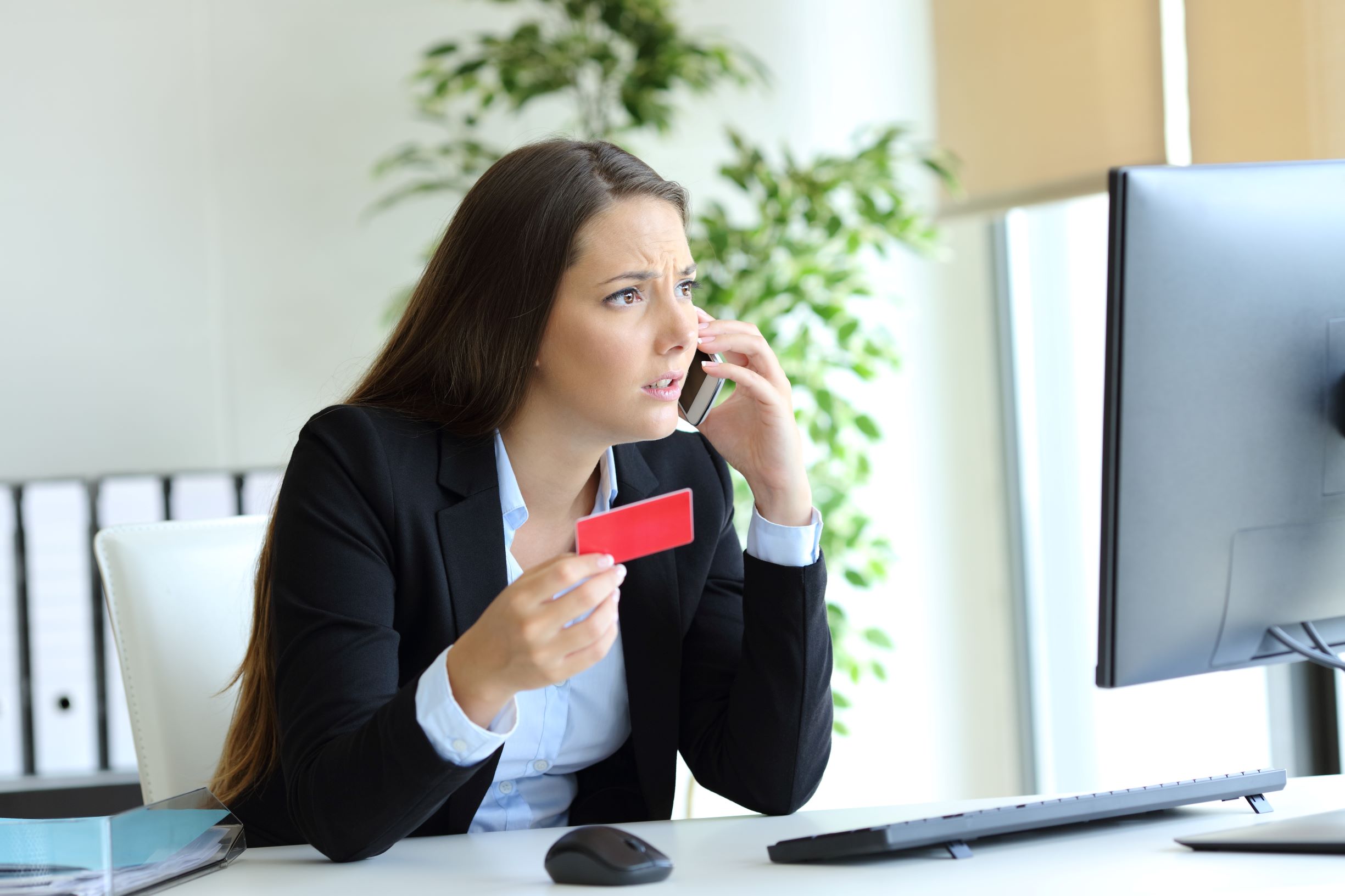 woman on phone confused with credit score